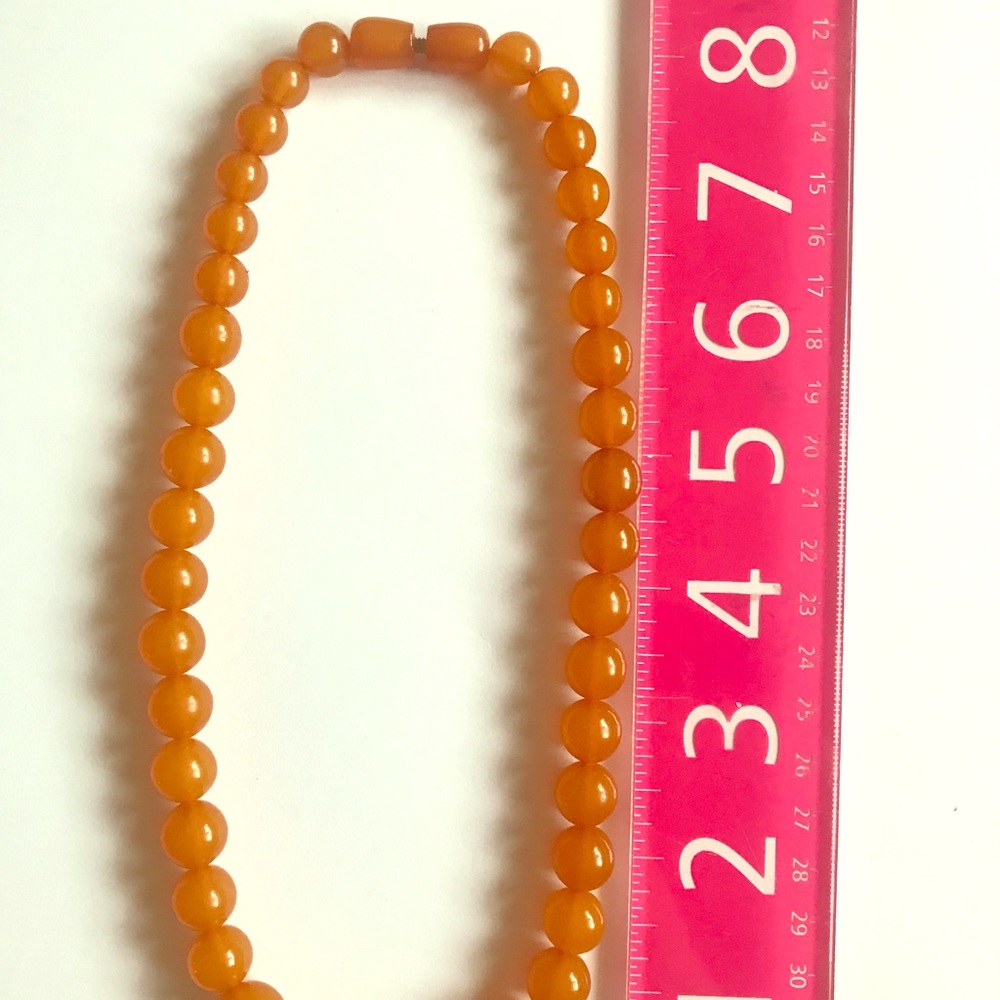 Like new.  AMBER NATURAL STONE